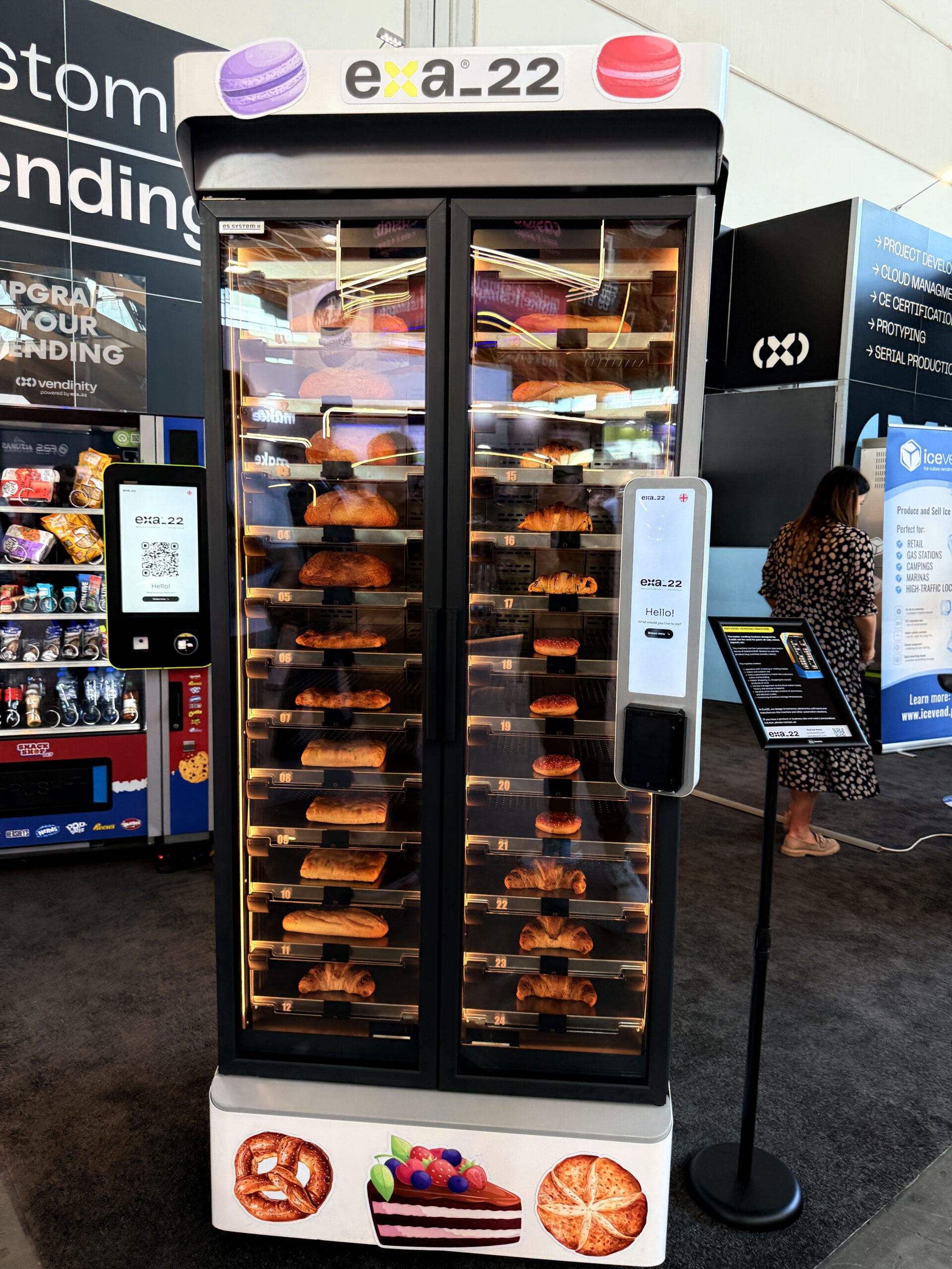 Individual compartments holding croissants and rolls inside a bakery vending machine