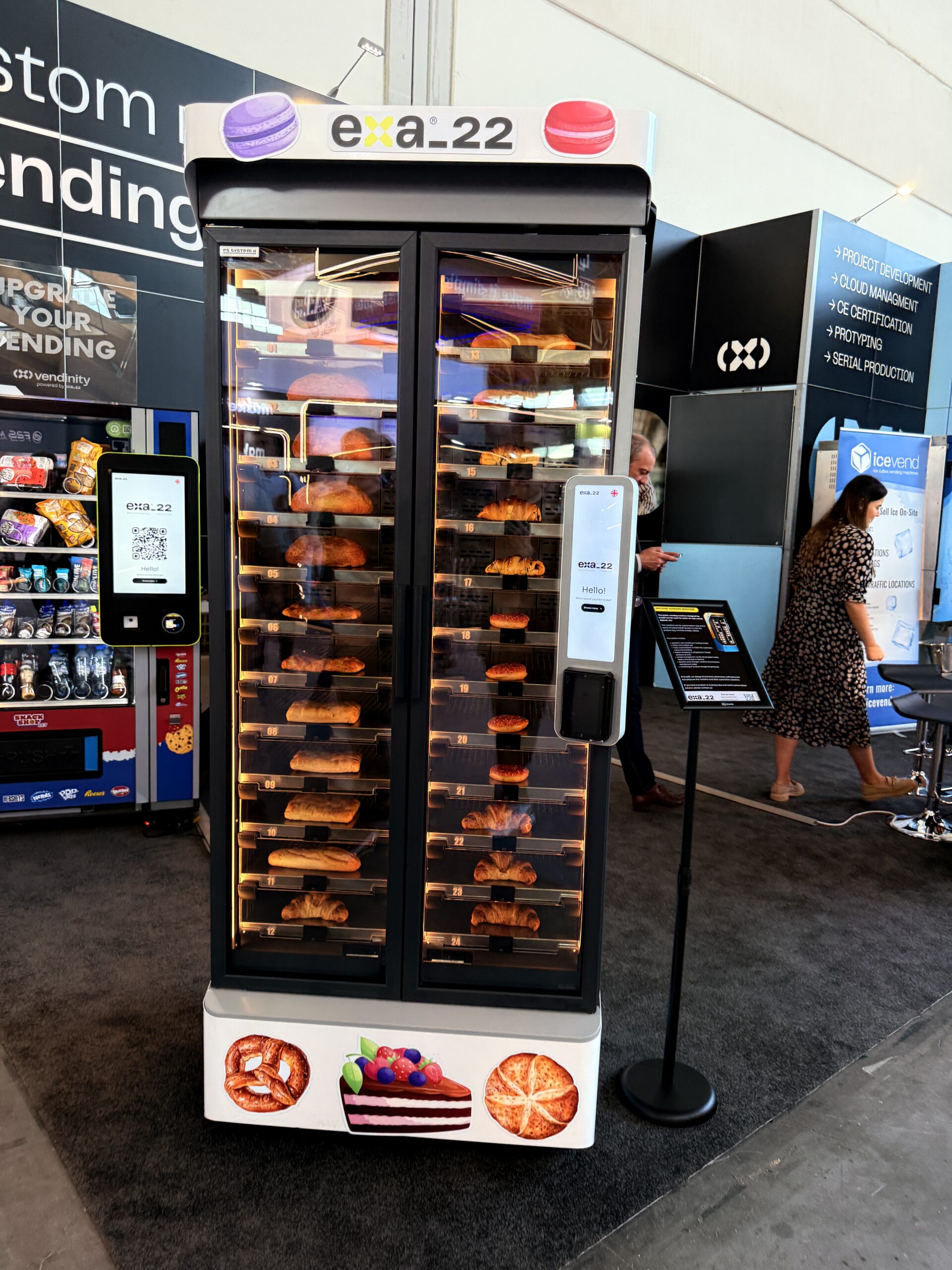 Touchscreen on a bakery vending machine displaying a greeting and product selection