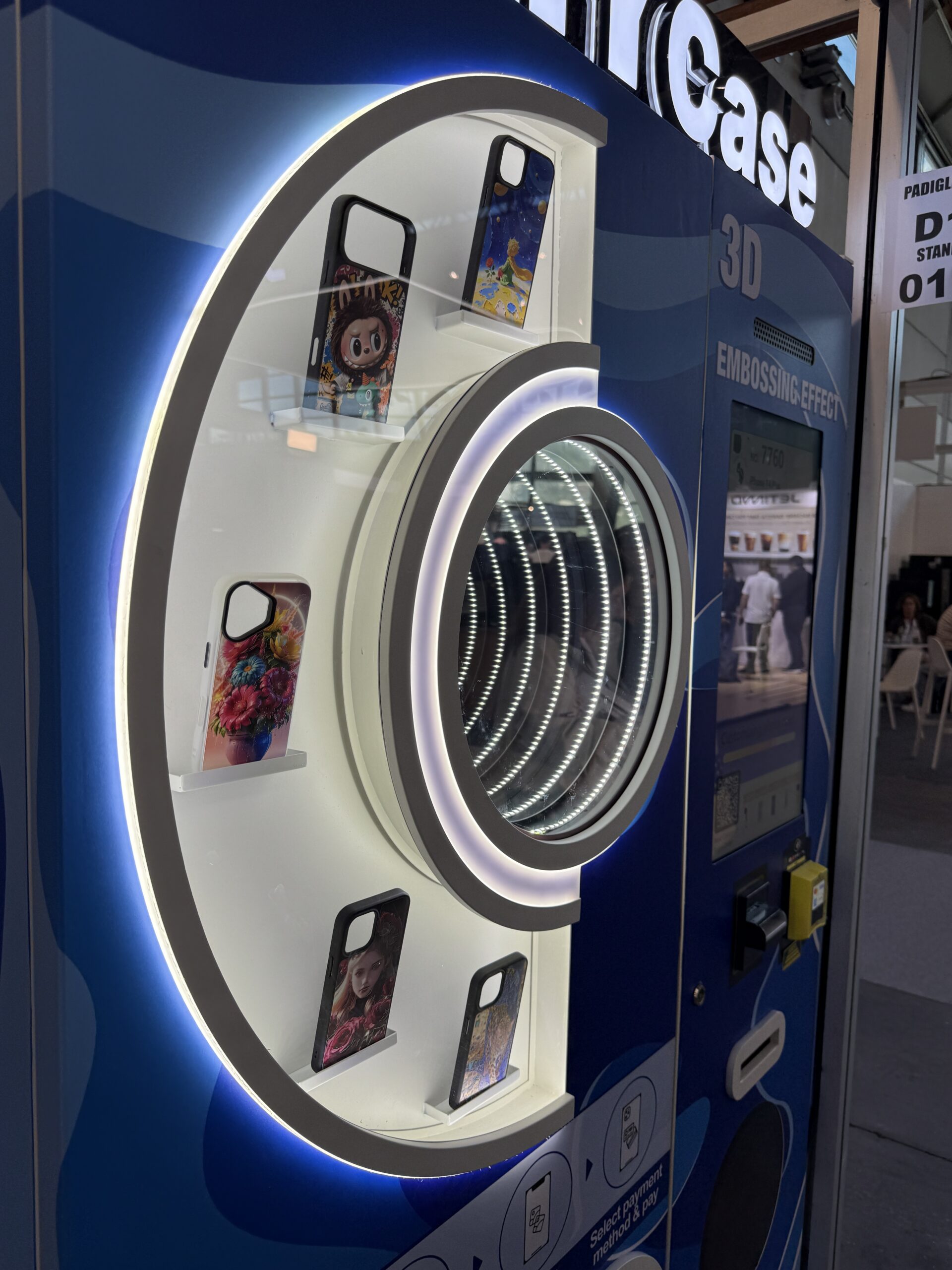 Order progress screen on a phone case printing vending machine