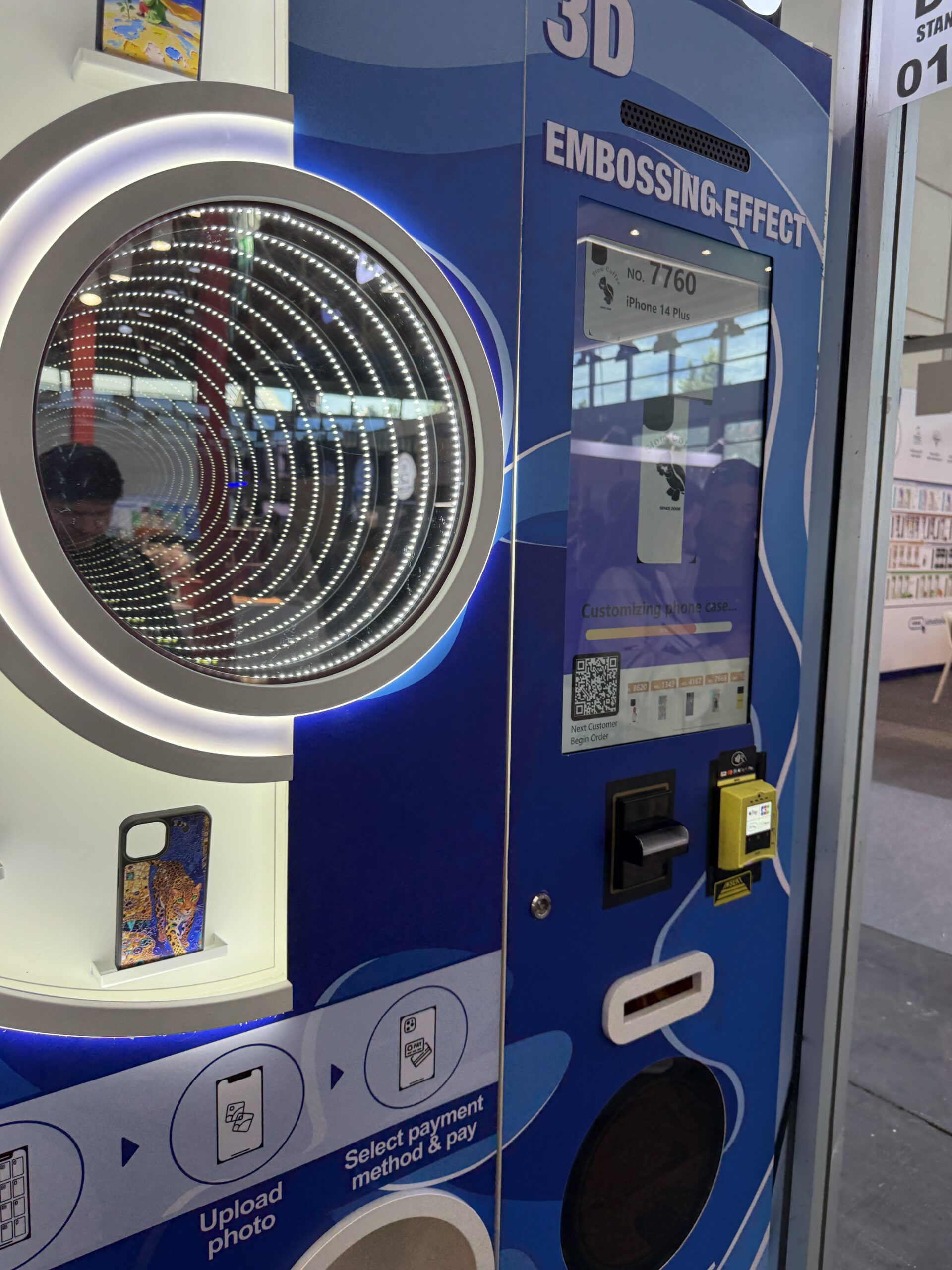 Sample printed cases displayed on a custom phone case vending machine