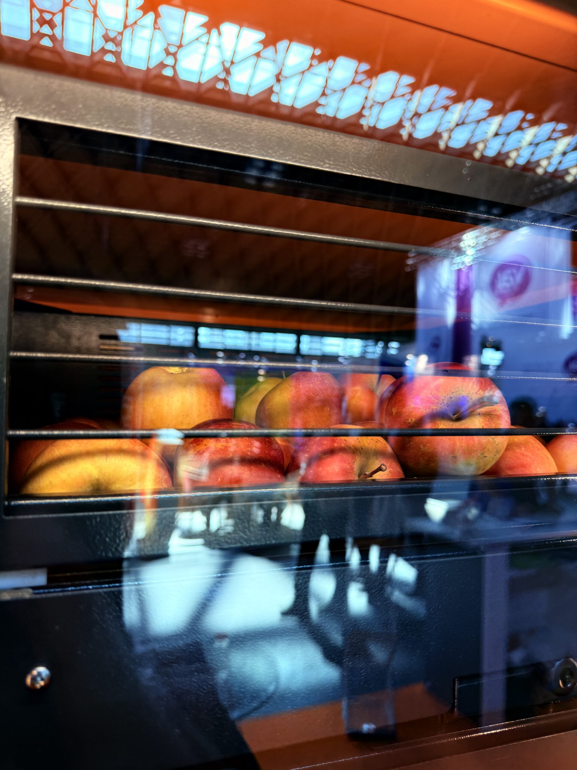 Fresh juice vending machine pickup area, a self serve premium amenity
