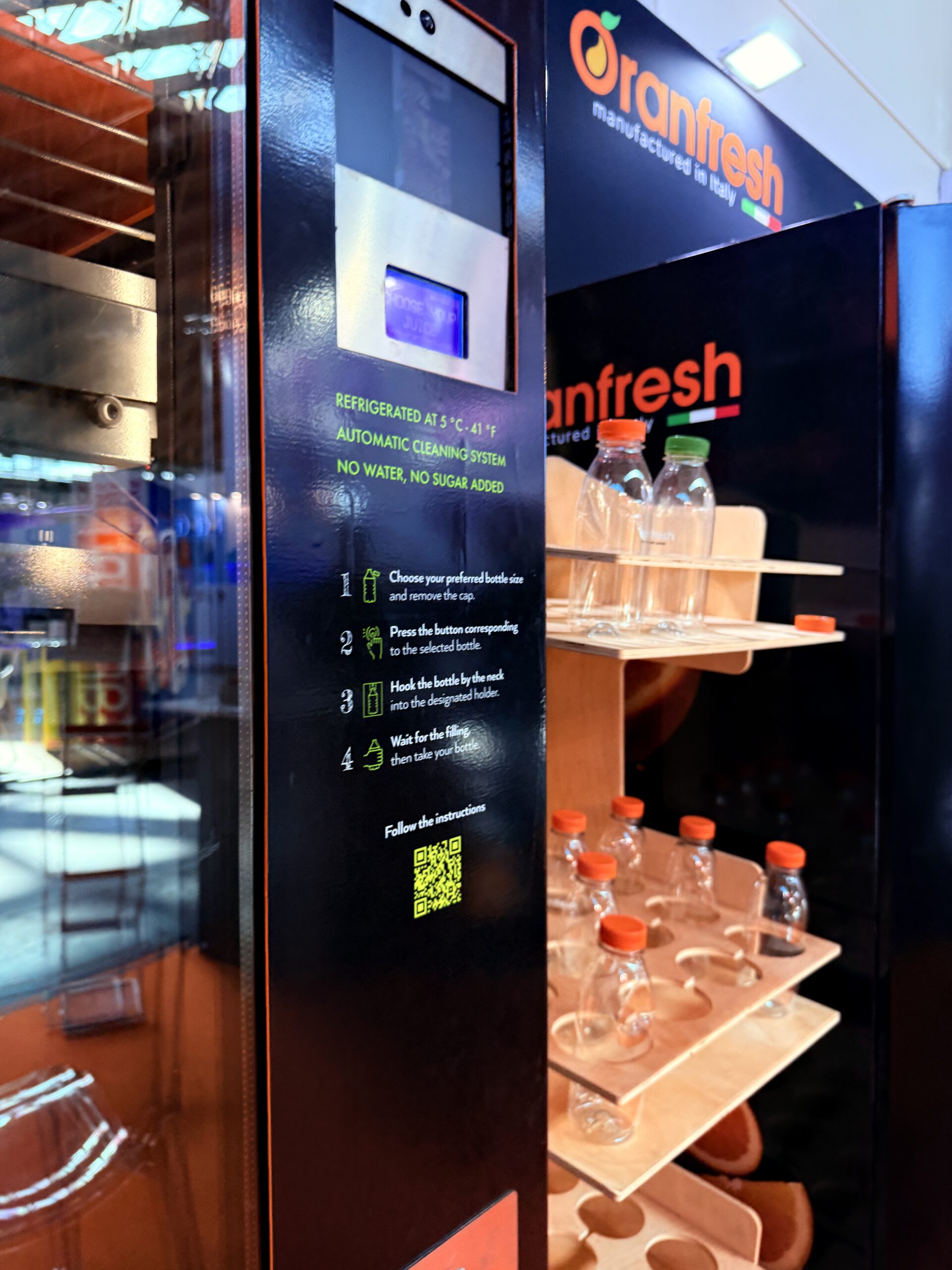 Fresh juice vending machine placed and branded in a venue setting