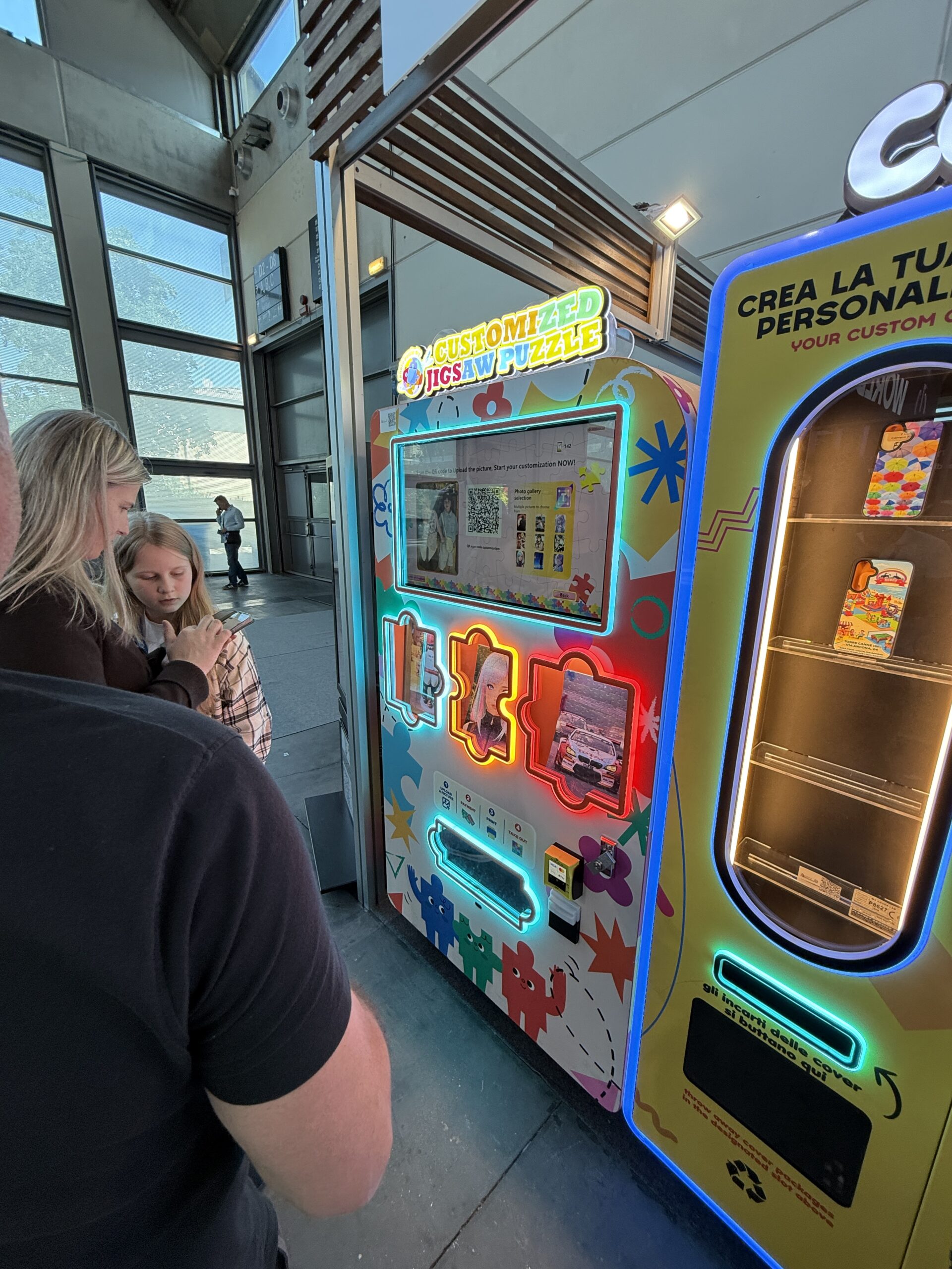 Personalisation machine screen showing photo selection and finished examples