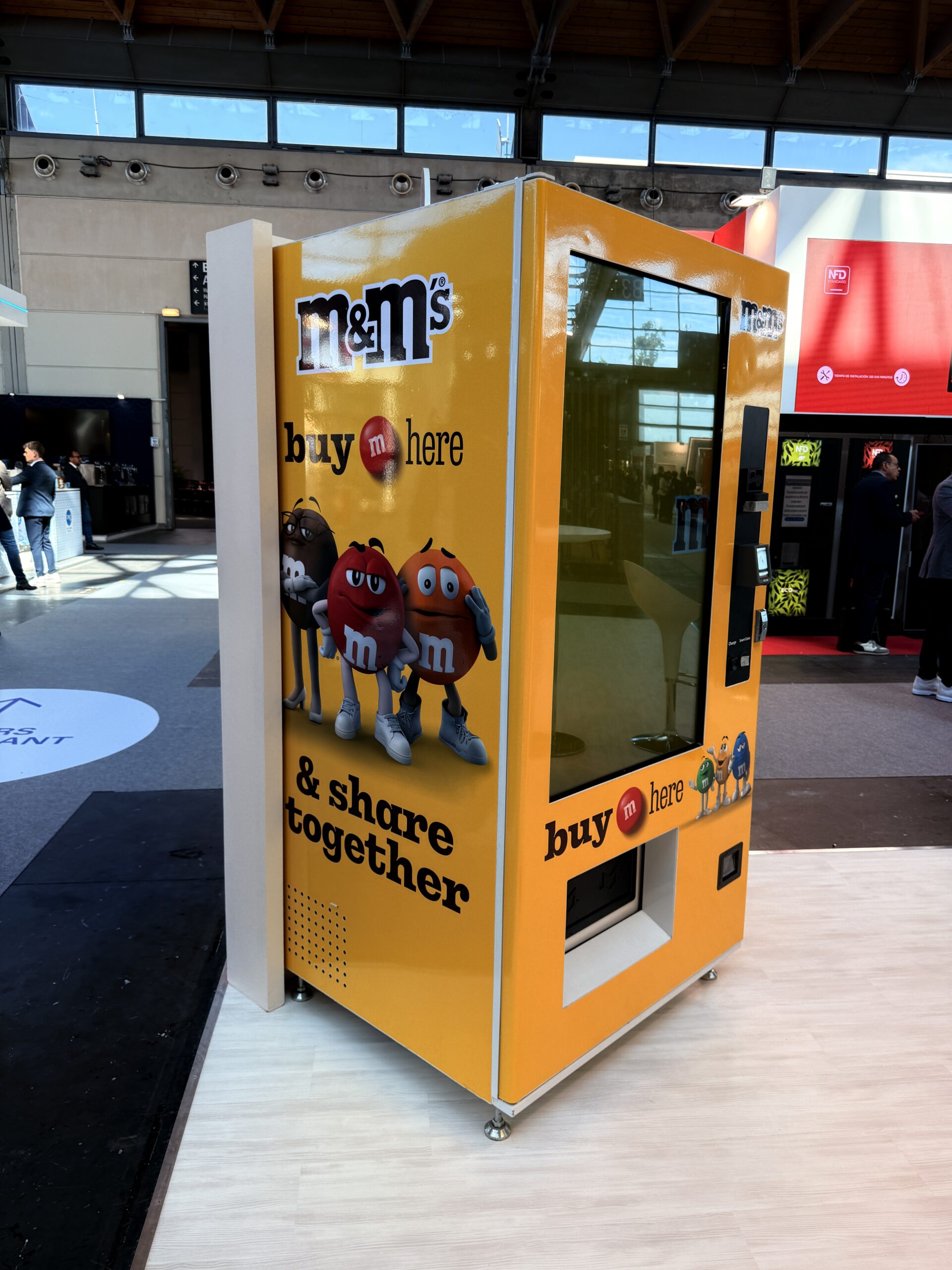 Branded vending machine with full colour graphics in a venue